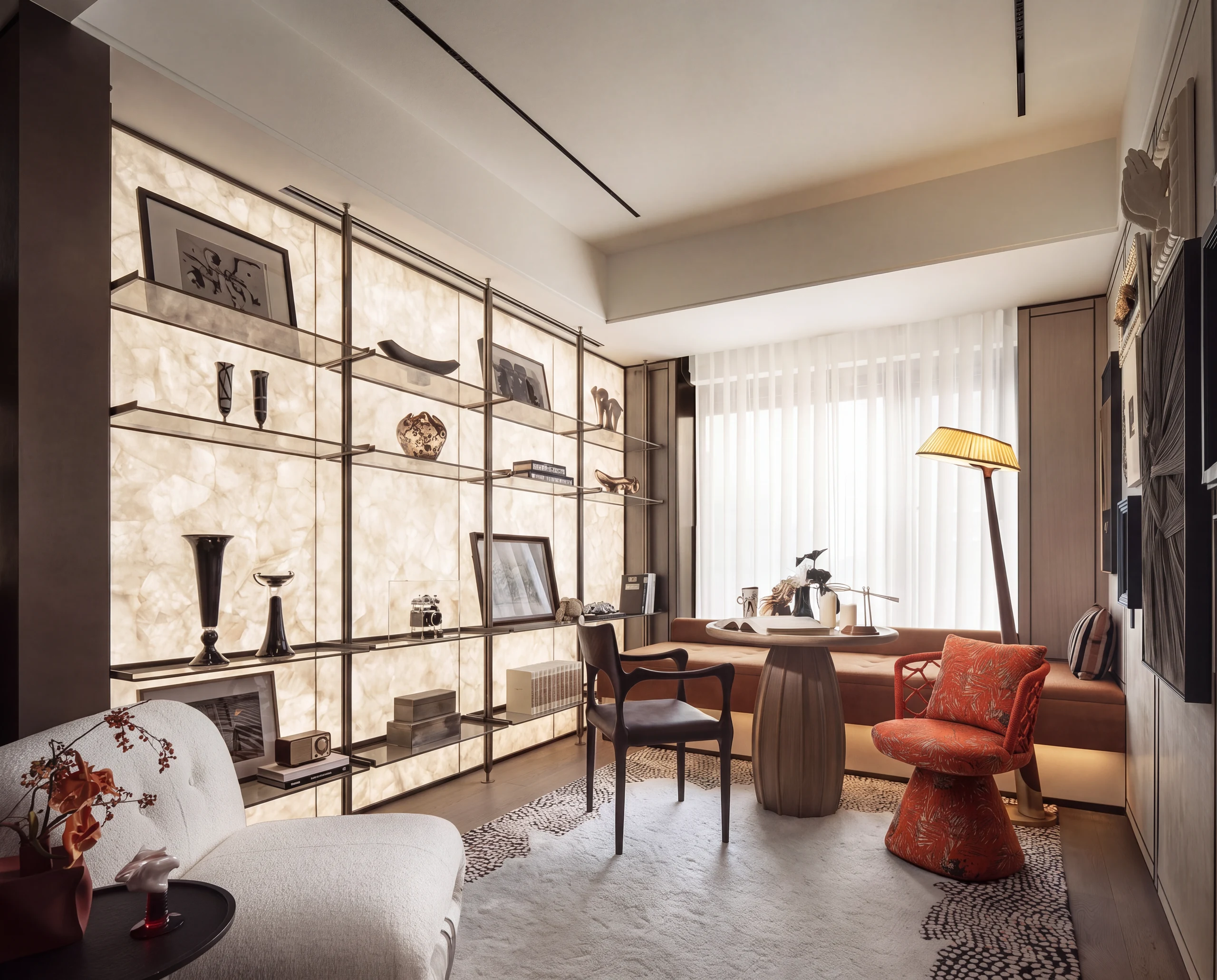 The study: a backlit onyx wall and a daybed by the window